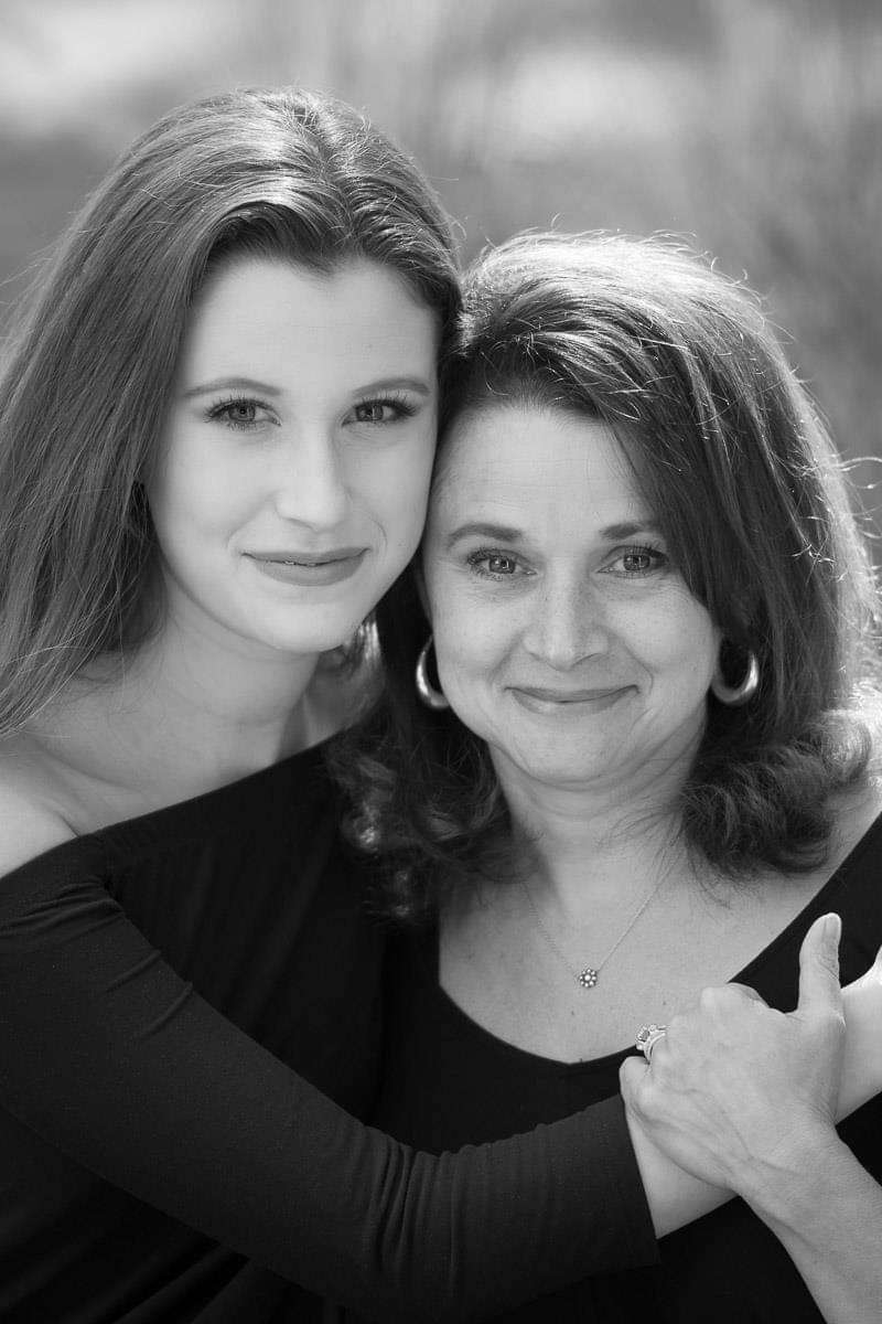 mother and daughter close in black and white
